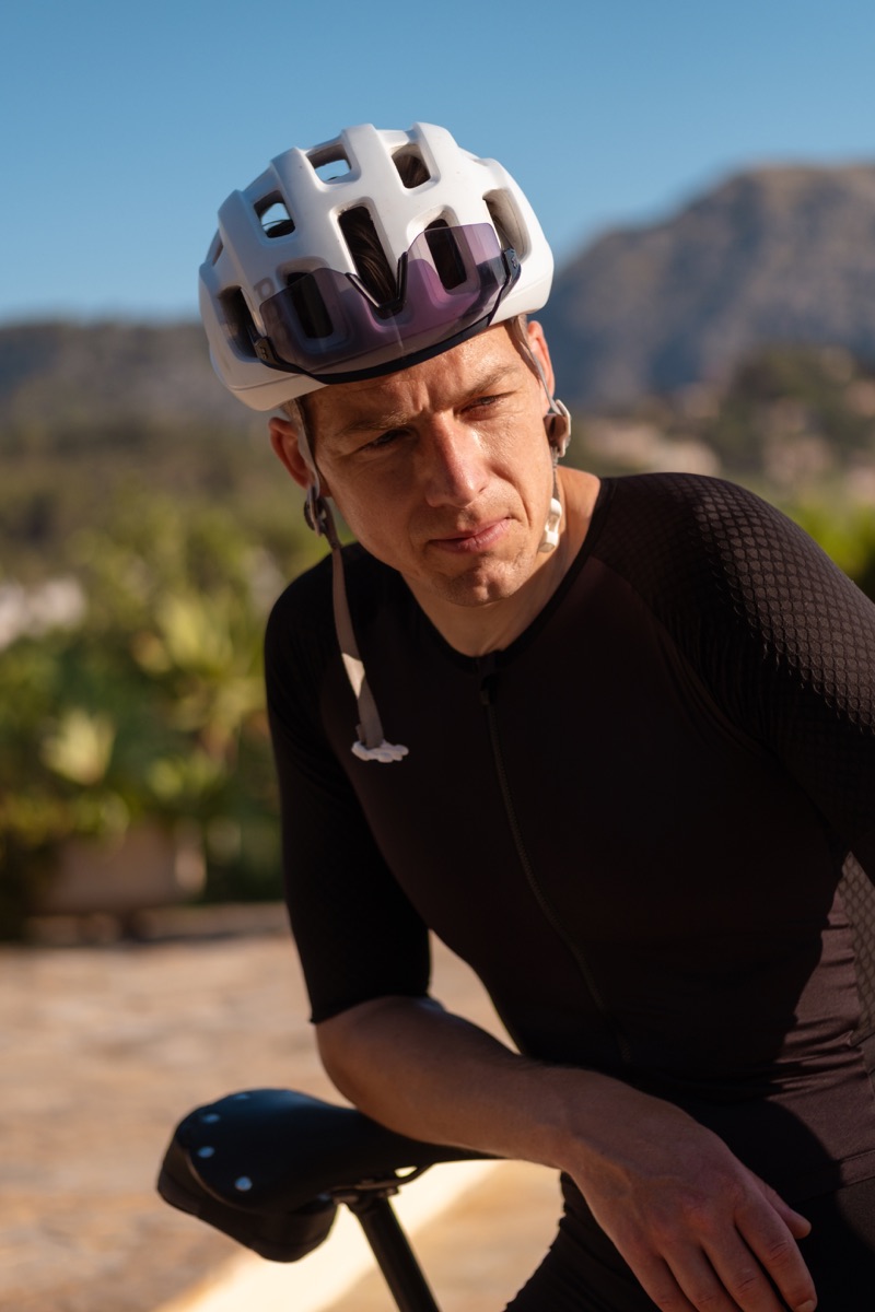 Gareth Winter in riding kit, mountains behind